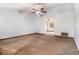 Large living room featuring a ceiling fan, neutral walls, and view to other room at 285 Independence Dr, Jonesboro, GA 30238
