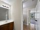 Bathroom vanity with sink and view to a connecting room at 400 Icicle Ct, Hampton, GA 30228