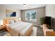 Serene bedroom featuring a comfortable bed, stylish decor, and a bright window view at 400 Icicle Ct, Hampton, GA 30228