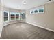 Spacious bedroom with neutral paint, carpet and a large window for natural light at 400 Icicle Ct, Hampton, GA 30228