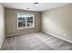 Bedroom featuring plush carpet, neutral walls, and a window for plenty of natural light at 400 Icicle Ct, Hampton, GA 30228