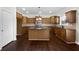 Spacious kitchen with an island, stainless steel appliances, and wooden cabinetry at 400 Icicle Ct, Hampton, GA 30228