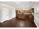 Kitchen with dark wood cabinets, stainless appliances, and hardwood floors at 400 Icicle Ct, Hampton, GA 30228