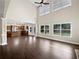 A two-story living room connects to an open-plan kitchen with plenty of light at 400 Icicle Ct, Hampton, GA 30228