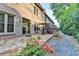 Backyard patio with lush garden and flowering shrubs at 6273 Clapham Ln, Johns Creek, GA 30097