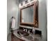 Bathroom featuring vanity with granite countertops, bowl sink, and ornate mirror at 6273 Clapham Ln, Johns Creek, GA 30097