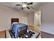 Bedroom boasts natural light, wood floors, and ceiling fan at 6273 Clapham Ln, Johns Creek, GA 30097