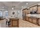Gourmet kitchen with a large island, stainless steel appliances, and custom cabinetry at 6273 Clapham Ln, Johns Creek, GA 30097