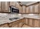 Gourmet kitchen featuring granite countertops, stainless steel appliances, and custom cabinetry at 6273 Clapham Ln, Johns Creek, GA 30097