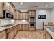 Gourmet kitchen featuring granite countertops, stainless steel appliances, and custom cabinetry at 6273 Clapham Ln, Johns Creek, GA 30097