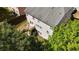 Aerial shot of the home highlighting the back deck and spacious, tree-lined backyard at 985 Forest Knoll Court Ct, Lithia Springs, GA 30122