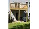 Beautiful two story home featuring a deck on both floors and a patio below in the backyard at 985 Forest Knoll Court, Lithia Springs, GA 30122