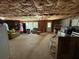 Unfinished basement offers large open space with exposed ceiling and potential for customization at 985 Forest Knoll Court, Lithia Springs, GA 30122