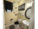 Charming bathroom features decorative mirrors, updated fixtures, and black accents at 985 Forest Knoll Court Ct, Lithia Springs, GA 30122