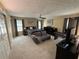 Comfortable bedroom featuring neutral carpet, furniture, a ceiling fan, and closet space at 985 Forest Knoll Court, Lithia Springs, GA 30122
