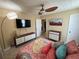 Inviting bedroom showcases modern furnishings, plush bedding, and a ceiling fan at 985 Forest Knoll Court, Lithia Springs, GA 30122