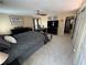 Bedroom with dark wood furnishings, workstation, and comfy grey comforter at 985 Forest Knoll Court, Lithia Springs, GA 30122