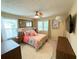 Charming bedroom with ceiling fan, colorful bedding, and natural light at 985 Forest Knoll Court Ct, Lithia Springs, GA 30122