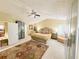 Well lit bedroom with ceiling fan, carpet, large rug, wardrobe and furniture at 985 Forest Knoll Court Ct, Lithia Springs, GA 30122