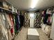Walk-in closet with custom shelving and organization systems at 985 Forest Knoll Court Ct, Lithia Springs, GA 30122