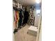 Organized walk-in closet with ample hanging and storage space and built-in shoe shelves at 985 Forest Knoll Court, Lithia Springs, GA 30122
