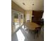 Eat-in dining area with table and chairs, a view of the deck, and a door to outside at 985 Forest Knoll Court, Lithia Springs, GA 30122