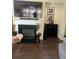 Living room featuring a decorative fireplace, a flat-screen TV, and stylish decor at 985 Forest Knoll Court, Lithia Springs, GA 30122