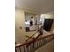 A hallway that leads into bedrooms and the living room, as well as containing wooden banisters at 985 Forest Knoll Court, Lithia Springs, GA 30122