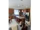 Spacious kitchen featuring an island with seating, stainless steel appliances, and modern pendant lighting at 985 Forest Knoll Court, Lithia Springs, GA 30122