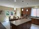 Bright kitchen featuring a central island, tile floors, and stainless steel appliances at 985 Forest Knoll Court Ct, Lithia Springs, GA 30122