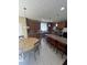 Bright kitchen features modern appliances, a large island, and tile flooring at 985 Forest Knoll Court, Lithia Springs, GA 30122