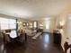 Open-concept living and dining space with hardwood floors and neutral wall paint at 985 Forest Knoll Court Ct, Lithia Springs, GA 30122