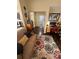 Comfortable living room with a couch, desk, and hardwood floors at 985 Forest Knoll Court, Lithia Springs, GA 30122