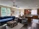 Comfortable living area with a large sectional sofa and an open floor plan to the kitchen at 985 Forest Knoll Court Ct, Lithia Springs, GA 30122