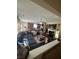 Spacious living room flows into a kitchen with island and dining area at 985 Forest Knoll Court, Lithia Springs, GA 30122