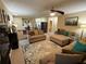 Spacious upper-level living room with comfortable seating, a ceiling fan and a view to other rooms at 985 Forest Knoll Court, Lithia Springs, GA 30122