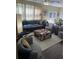 Inviting living room with a comfortable sectional sofa and oversized patterned chairs at 985 Forest Knoll Court, Lithia Springs, GA 30122