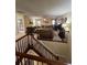 View of the living room showcasing a cozy seating area and a ceiling fan with a light fixture at 985 Forest Knoll Court, Lithia Springs, GA 30122
