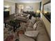 Inviting living room features a cozy couch, patterned rug, and dining area in the background at 985 Forest Knoll Court, Lithia Springs, GA 30122
