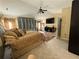 Primary suite showcases a ceiling fan, TV, and closet space at 985 Forest Knoll Court, Lithia Springs, GA 30122