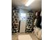 Walk-in closet featuring ample storage in a rotating shoe rack system and clothing racks at 985 Forest Knoll Court, Lithia Springs, GA 30122