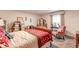 View of a bedroom with a sleigh bed, patterned rug, pink chair and large window at 2985 Duke Of Gloucester, Atlanta, GA 30344