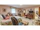 Cozy bedroom with a rocking chair, a bed with quilt, and cluttered decor at 2985 Duke Of Gloucester, Atlanta, GA 30344