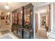 Elegant entryway with a decorative display cabinet and classic decor at 2985 Duke Of Gloucester, Atlanta, GA 30344