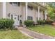 Charming home with a classic front door, white columns, and lush landscaping at 2985 Duke Of Gloucester, Atlanta, GA 30344