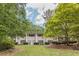 Traditional home with a white brick facade, symmetrical windows, and well-manicured landscaping at 2985 Duke Of Gloucester, Atlanta, GA 30344