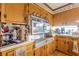 A view of the kitchen area featuring wood cabinets and vintage oven at 2985 Duke Of Gloucester, Atlanta, GA 30344