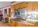 A view of the kitchen area featuring wood cabinets and vintage oven at 2985 Duke Of Gloucester, Atlanta, GA 30344