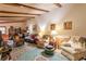 Spacious living room with wood beam ceiling and a decorative rug at 2985 Duke Of Gloucester, Atlanta, GA 30344