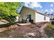 Exterior view of the house with a spacious patio and a yard at 320 Little Creek Rd, Lawrenceville, GA 30045
